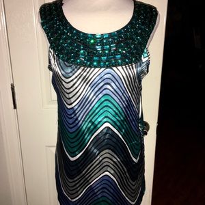 Beautiful top with emerald-tone “stones”. NWOT